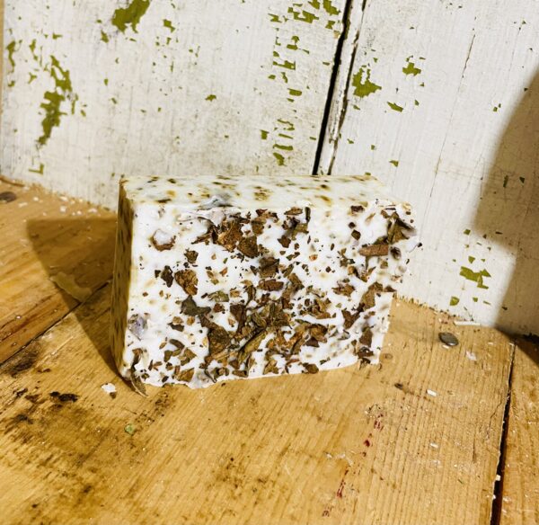 A bar of tobacco anti-aging soap, displayed against a neutral background.