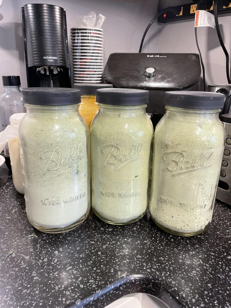 Three 1/2-gallon jars filled with freeze-dried zucchini