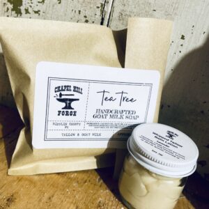 Two skincare products for natural acne care set: a bar of acne soap with tea tree essential oil and a jar of lavender whipped tallow balm.